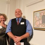 WSU student Colin Plante with Juliet Feibel, ArtsWorcester executive director. Colin's watercolor is also visible.