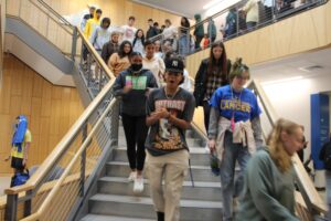 New students descend the staircase in the Wellness Center