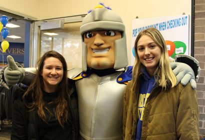 WSU students Sarah Deslauriers (left) and Anna Billings with WSU mascot Chandler at the ribbon cutting for the newly renovated campus bookstore.