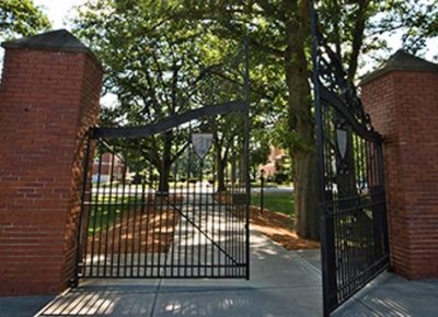 The open Tiffany gates in front of the Worcester State campus