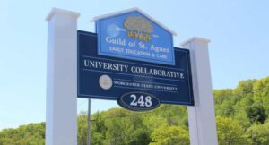 Large sign that reads Guild of St Agnes Early Education & Care, University Collaborative, Worcester State University