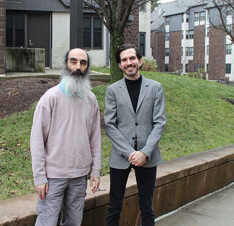 Hy Ginsberg and Riley McGuire standing outside Sheehan Hall