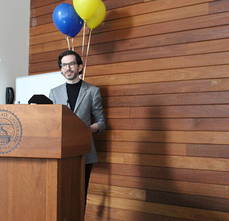 Riley McGuire at the podium