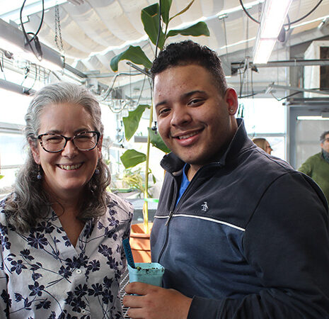 Aleel Grennan and Victor Martinez in the greenhouse