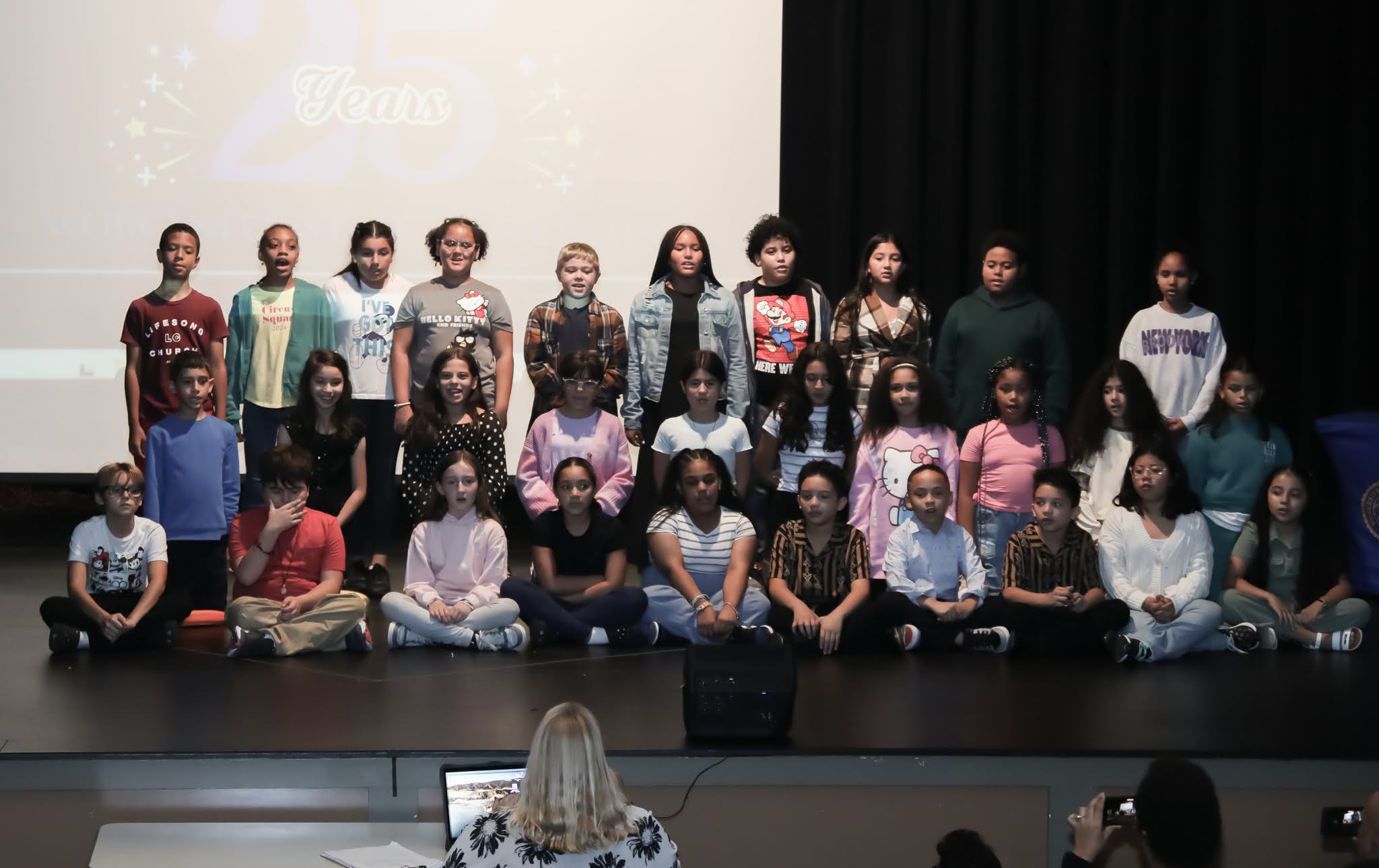 The Chandler Magnet/La Familia School Choir on stage at the event