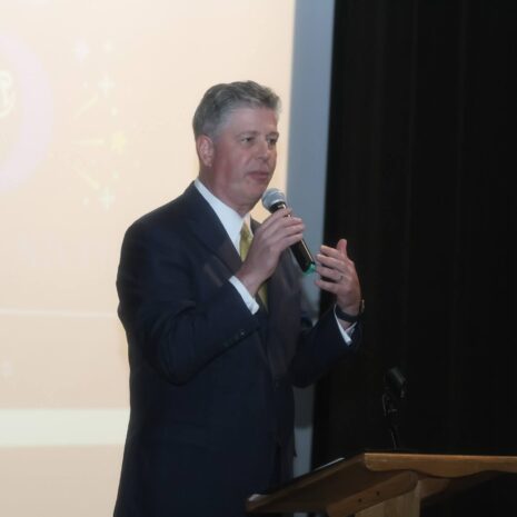 President Barry M. Maloney onstage at teh event