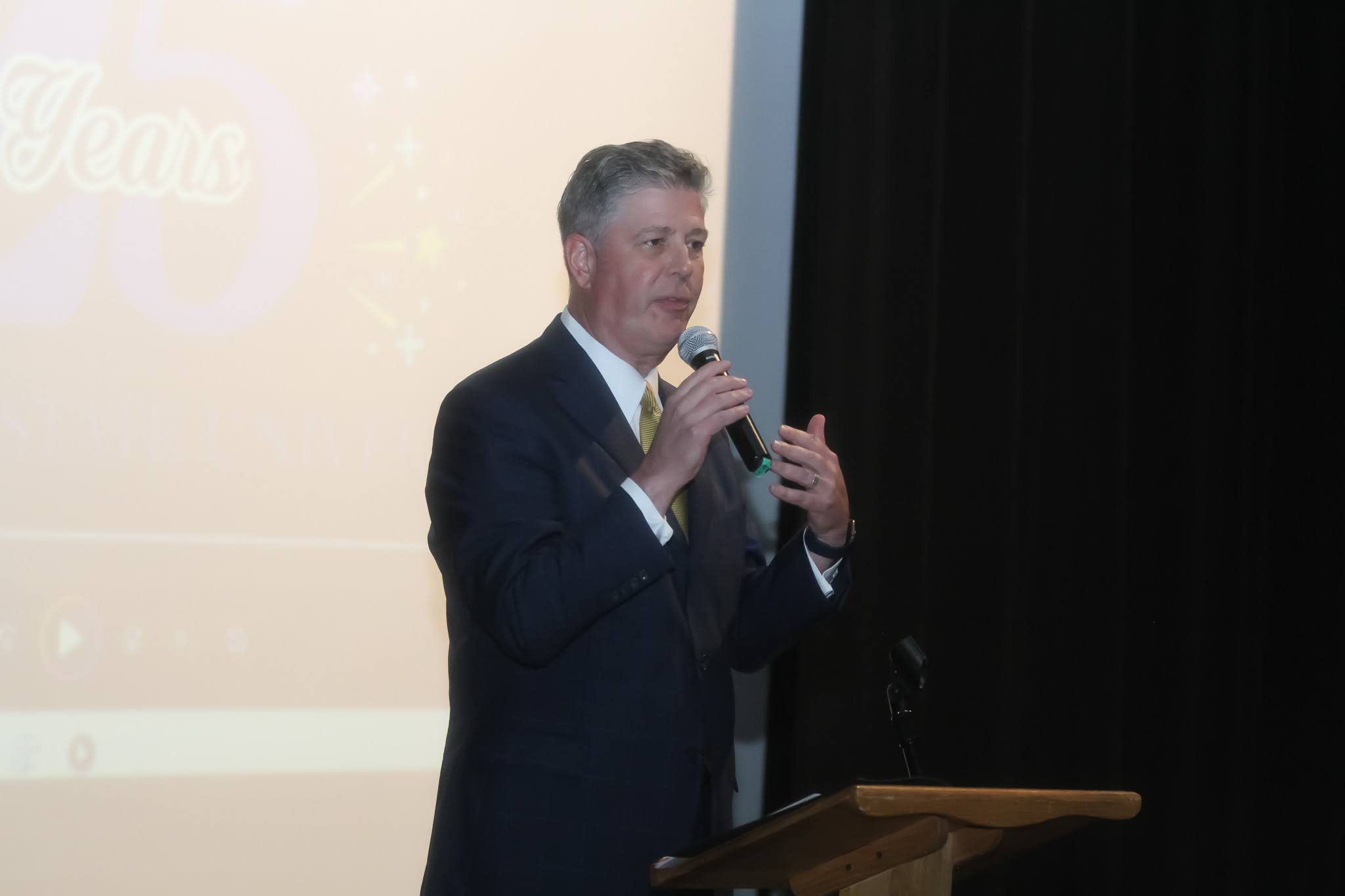 President Barry M. Maloney onstage at teh event