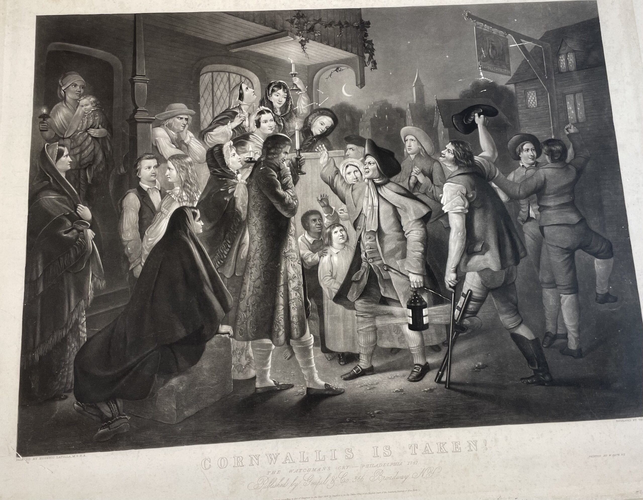 A group of people gathered at night in front of a house