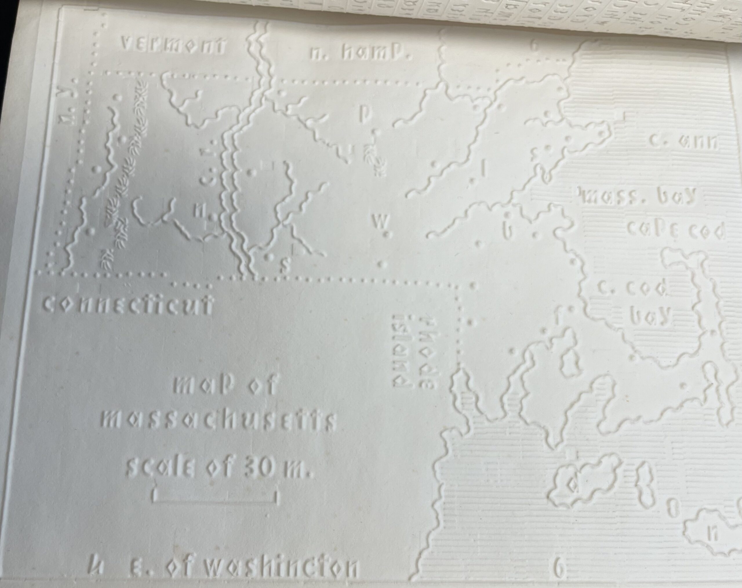 The outlines of Massachusetts are raised