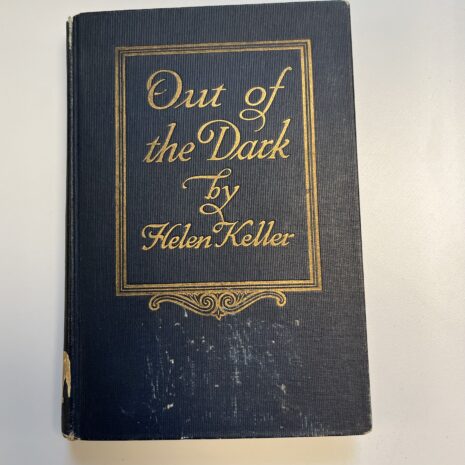 The cover of an old book, Out of the Dark by Hellen Keller